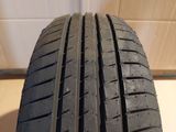 a close up of a tire on a wooden surface