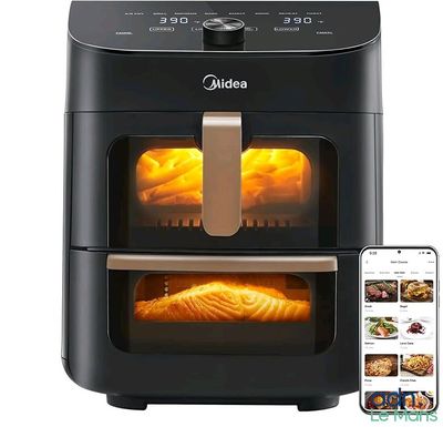une friteuse à air chaud contenant des aliments, posée à côté d'un téléphone portable