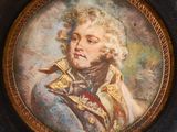portrait of a man in a military uniform in a gold frame