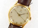 an image of a close up of a wrist watch on a white surface