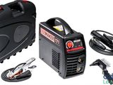 a black and red portable welding machine and other tools