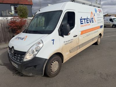 a white van that is parked in a parking lot