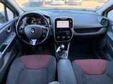 the interior of a small car with a steering wheel and dashboard