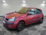 a picture of a small red car parked in a garage