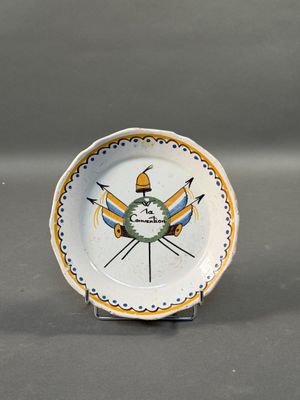 a white plate with a yellow and blue design on it