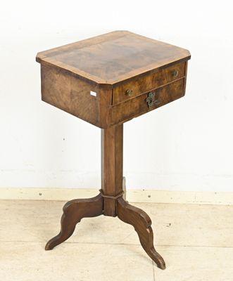 a small wooden table with a drawer on top of it