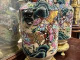 two vases that are sitting on a table