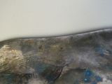 a close up of a sculpture of a horse on a table