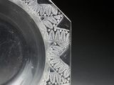 a glass plate with a design on it on a table