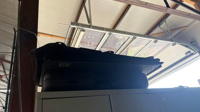 a stack of luggage sitting on top of a cabinet