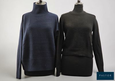 two women ' s sweaters on mannequins on a mannequin stand
