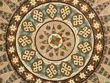 an image of a circular tile with a design in the center