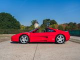 the red sports car is parked in the parking lot