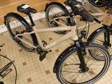 two bikes that are sitting on the floor in a room