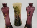 three vases that are sitting on a table