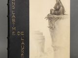 an old book sitting on top of a table next to a cup