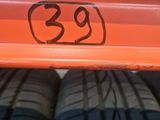 a close up of three tires on a shelf with the number 39 on them