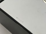 a box with a ring on top of it on a table
