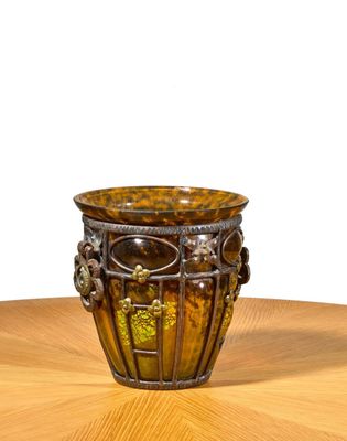 a vase that is sitting on a wooden table