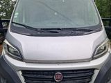 a white van that is parked in the parking lot