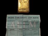 an image of a gold bar next to a passport