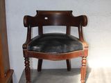 a chair that is sitting on top of a cabinet