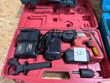 a red tool case with tools in it on a table
