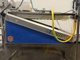 an image of a machine that is working on a conveyor belt