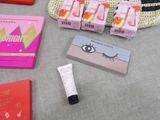 many items that are sitting on a table next to a purse