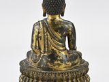 an image of a statue of a person sitting on top of a table