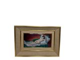 tableau représentant une femme allongée sur un lit, dans un cadre doré