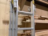 a ladder that is leaning against a wall in a room