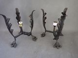 three metal candlesticks with a candle holder on each of them