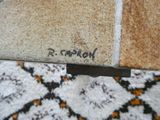 a close up of a piece of furniture with a name on it