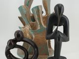 a figurine of a man and a woman standing next to each other