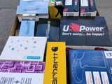 many boxes of electronic devices sitting on the ground