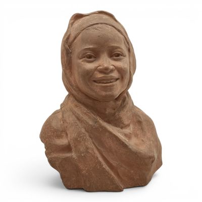 an image of a clay bust of a woman wearing a headscarf