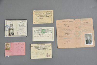 some old papers and stamps are sitting on a table