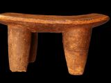 an image of a wooden stool on a black background