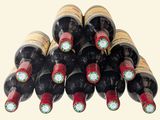 many bottles of wine stacked on top of each other