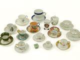 a lot of tea cups and saucers on the table