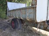 a rusted truck that is sitting in the grass
