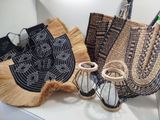 two bags and a pair of sandals on a table