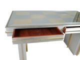 an image of a desk with a glass top and drawers
