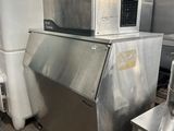 a machine that is sitting in a warehouse with other machines