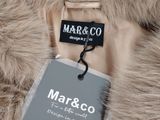 a close up of a coat with a tag on it