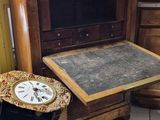 many boxes of clocks on the floor in a room