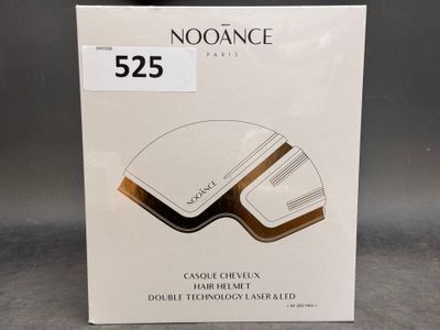 une photo d'une boîte de produits capillaires Noorance posée sur une table