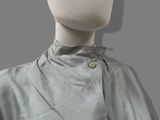 an image of a mannequin dressed in a gray dress