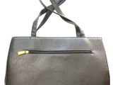 a black leather handbag with a zipper on the front
